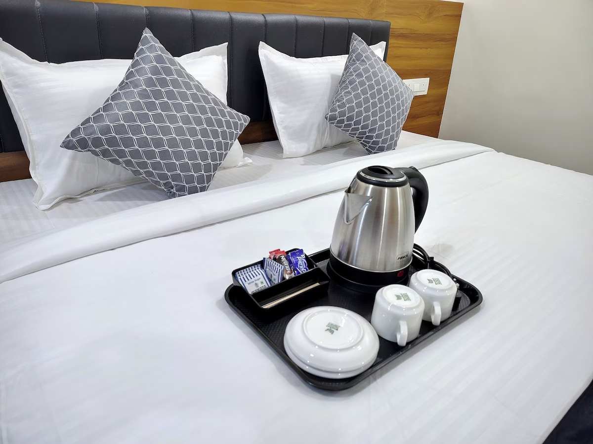 Tea and coffee tray on bed
